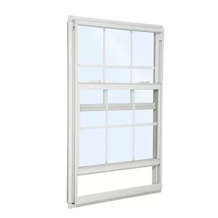 White vertical sliding window with grid panes